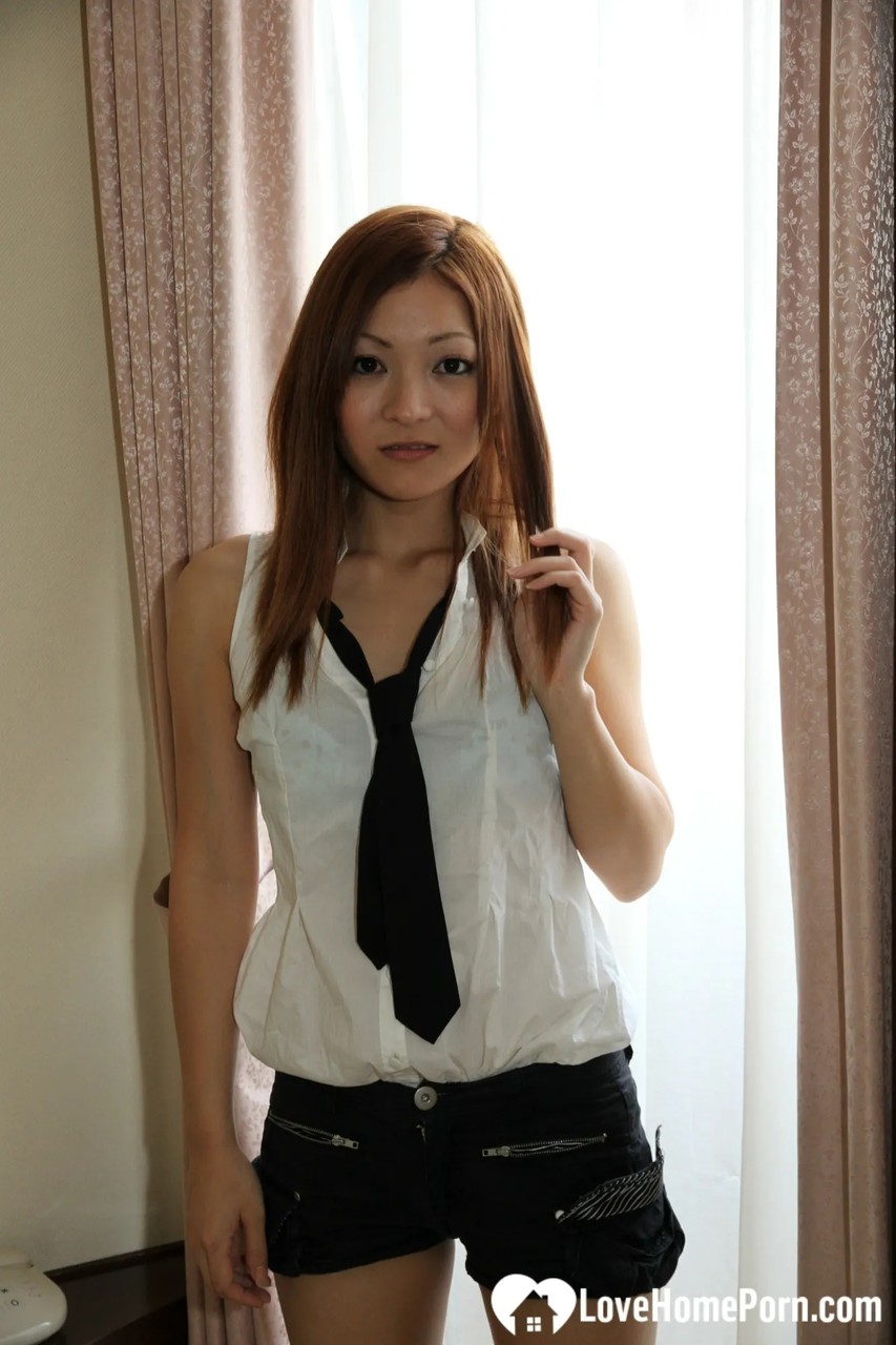 Hot Japanese Schoolgirl Doffs Her Sexy Uniform And Spreads Her Bushy Twat