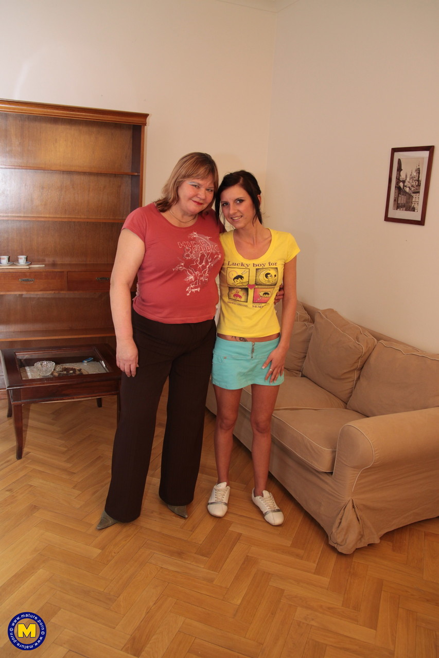 Ada, the young lesbian with a mature BBW Jeanie, wears a strapon dildo.