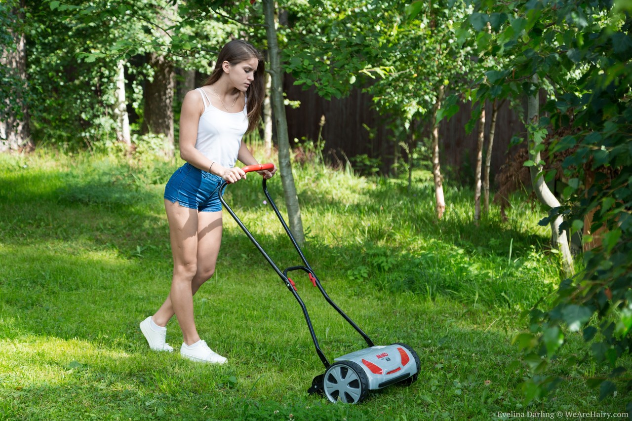 Teen in denim shorts Evelina Darling rubs her bush after mowing the yard