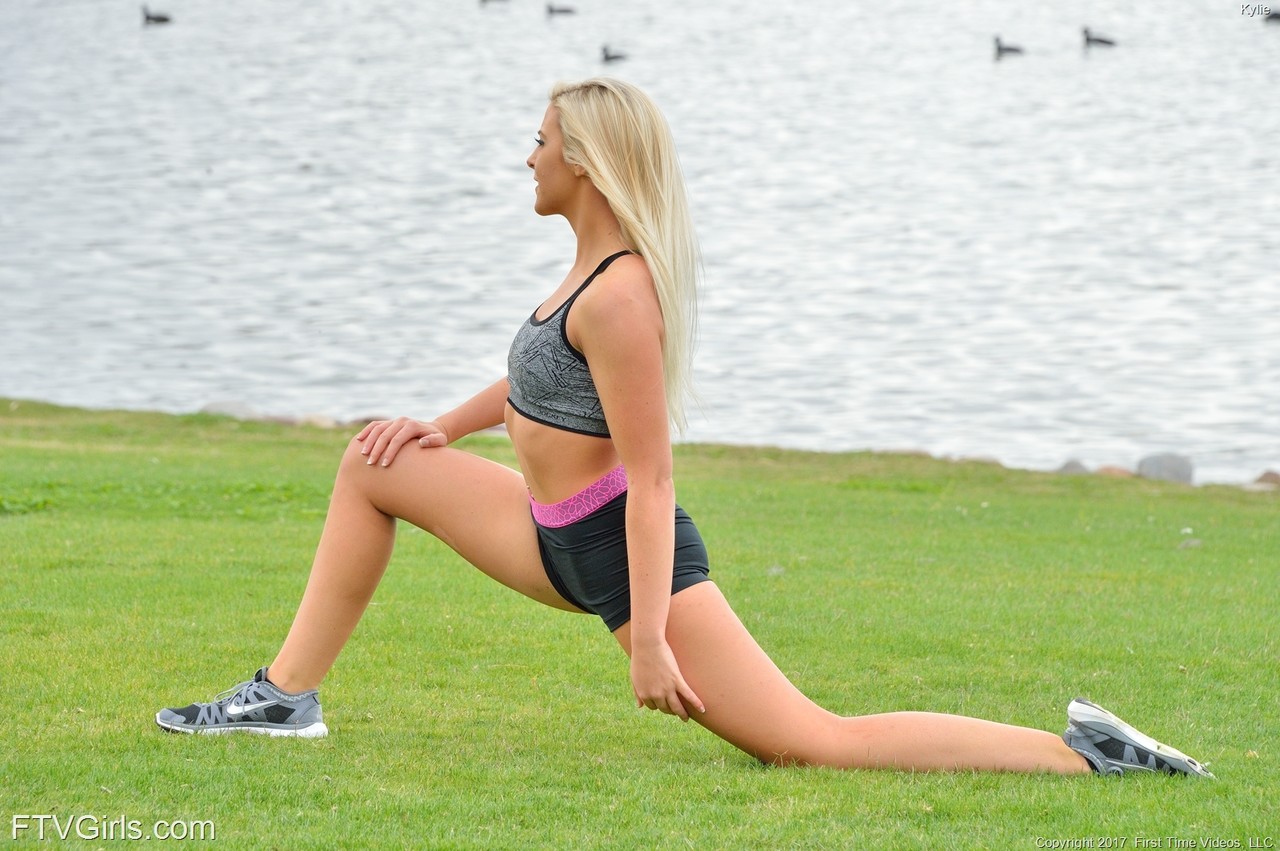 Taking off her fitness shorts and getting nude, tiny blonde Kaylie does the handstand pose.