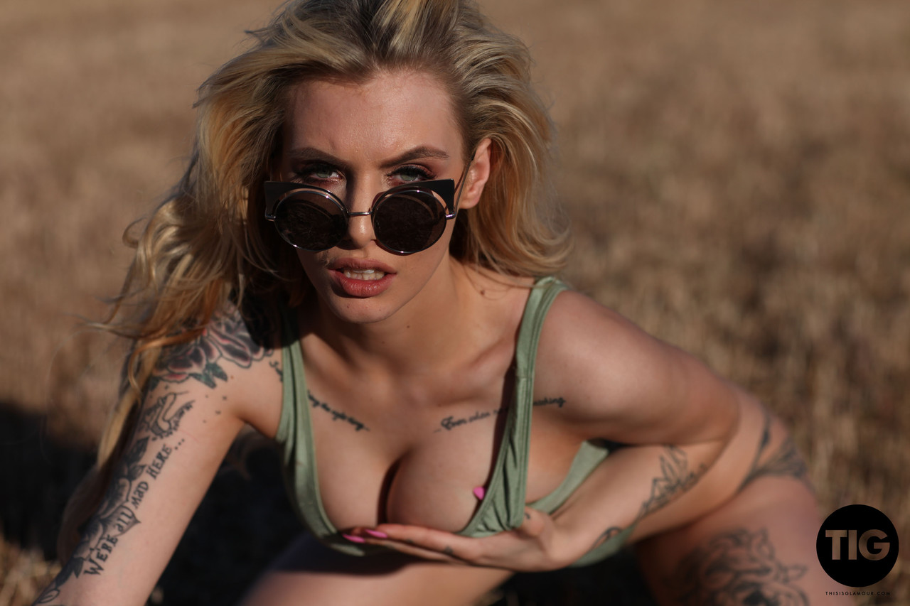 Blonde model with tattoos Saskia Valentine shows her fine breasts outdoors порно фото #428530445