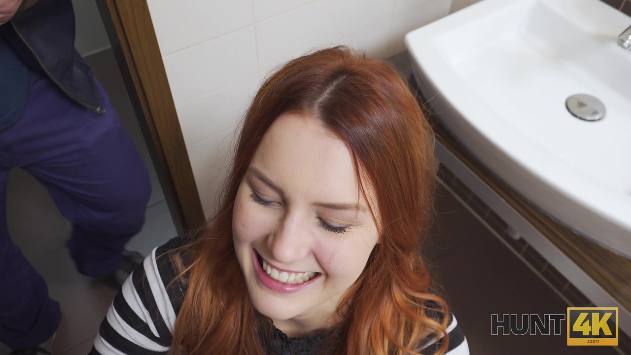 Stunning redhead giving phenomenal BJ and fucking in the public toilet photo porno #427078864