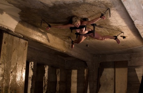 The ceiling is the location where Chloe Camilla, a blonde girl, stands completely naked.