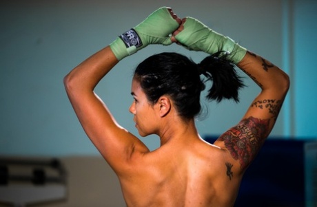 Tandem female Dana Vespoli displays her as she braces during a weigh-in.