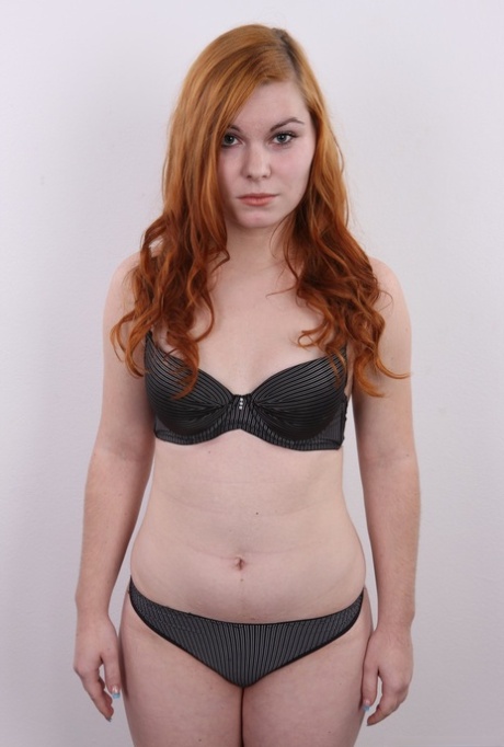 Hanna displays her A-cup tits and curvaceous abs for the first time, as she is known for her chubby red hair.