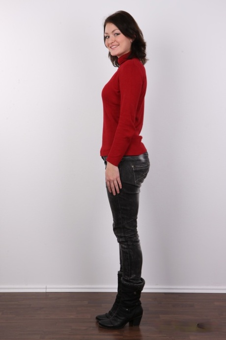 The first timer, Nela, showcases leather pants and a sweater before standing without clothes.