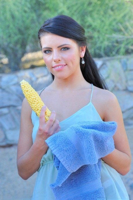 Teen girl with dark hair and a tight ass pleasures herself with corncob dildo