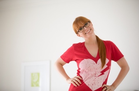 Redhead Chick Exposes Her Big Natural Tits Wearing Nerdy Looking Glasses