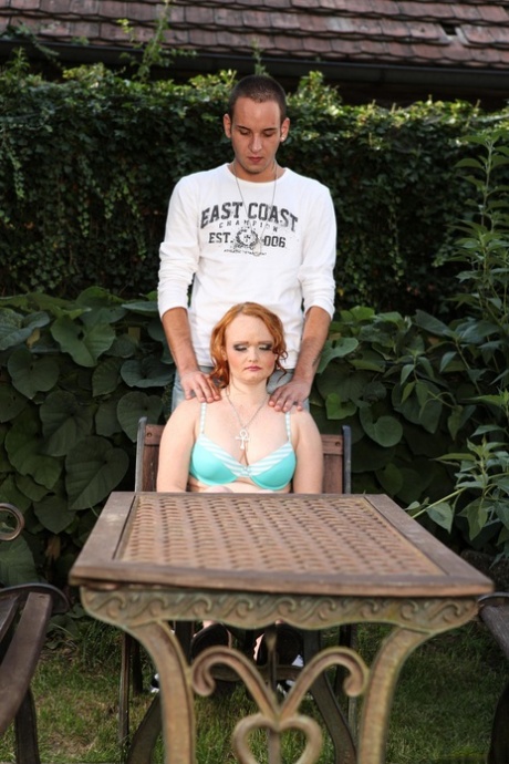 After a pale redhead face, the man sits in his backyard and begins to tug on their penis.