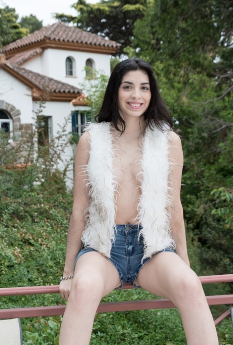 The amateur-like Ornella removes her shorts and thong to exhibit her hairy mufa.