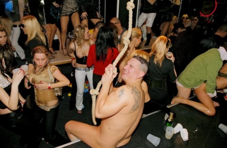 Club Going Chicks Perform Oral Sex While The Party Rages On