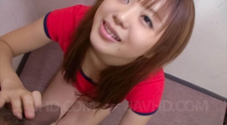 The phallus head is taken care of by Noriko Kago, an Asian doll wearing a red T-shirt.