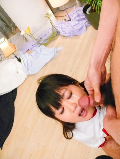 Ryo Asaka, a young Japanese girl, experiences an orgasm on her face while kneeling down.