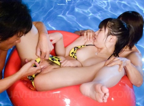 Japanese girl Hinata Tachibana engages in sexual activity with two boys at a pool table.