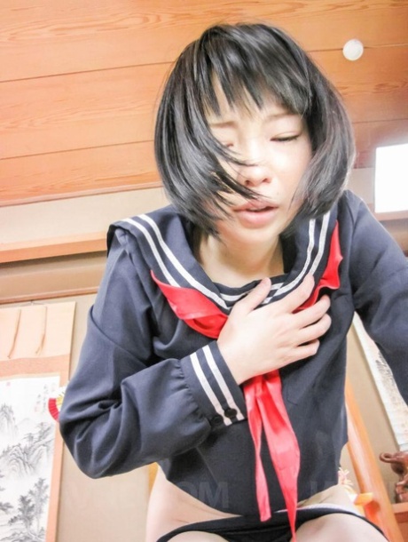 In her uniform, Japanese student Yuri Sakurai performs oral and vaginal intercourse.