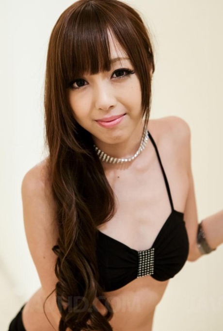 In her tight skirt, Anri Asian fondles her cans and licks the penis.