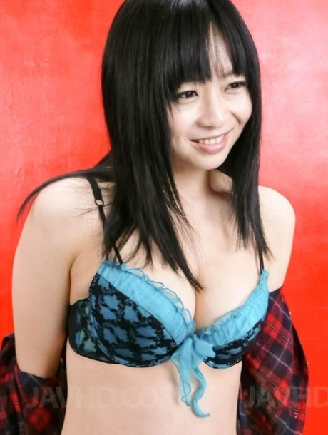 Nozomi Hazuki, the Japanese beauty, bares herself before engaging in self-pleasure.