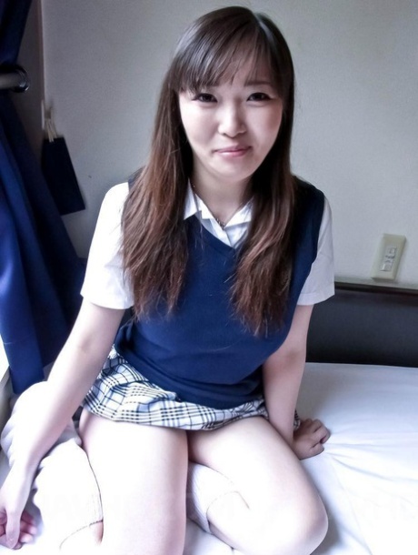 The fully developed breasts of Japanese schoolgirl Haruka Ohsawa are uncovered by her.