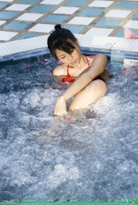 Young Japanese Girl Tales Off Her Bikini In An Outdoor Hot Tub