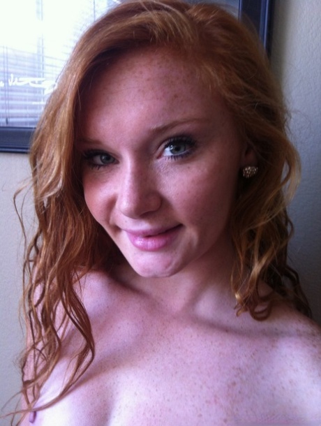 Redhead naturalist Alex Tanner takes off her pink lingerie for nude selfies.
