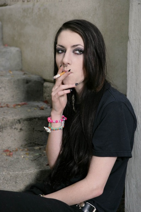 Brunette Teen Smokes In A Stairwell Prior To Giving A Blowjob
