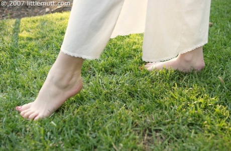 Young amateur walks about barefoot before giving a footjob and fucking