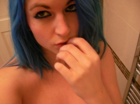 British girl with blue hair Emma J Black takes selfies while being nude.