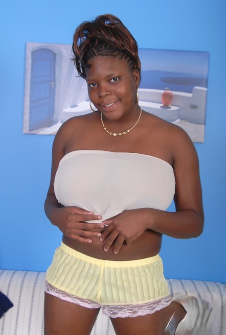 Older Black Woman Athena Holds Her Large Breasts While Getting Undressed