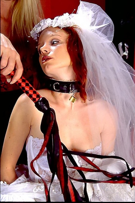 Redhead Female Submits To A Blonde Lesbian While In A Wedding Dress
