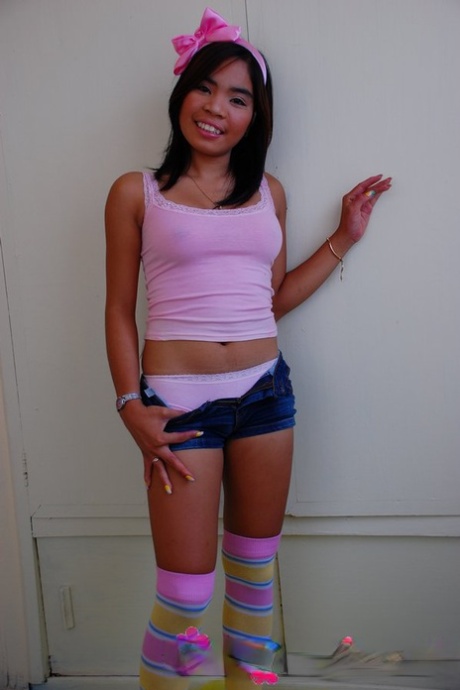 Cute Filipina teen gets naked with her panties wadded into her mouth