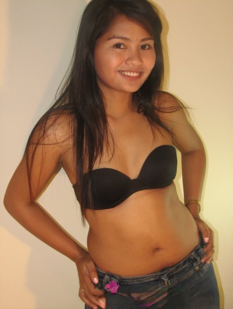 Filipina teen uncovers her firm tits before starting to peel off her underwear