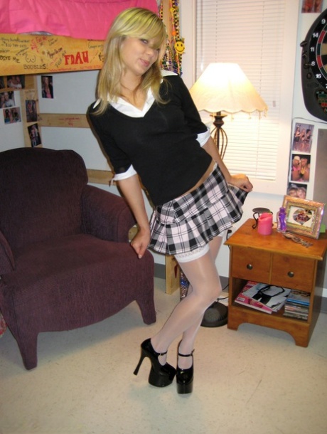 Dressed in stockings and a white Thong, Kasia is the little girls' schoolmate with her Naughty Face.