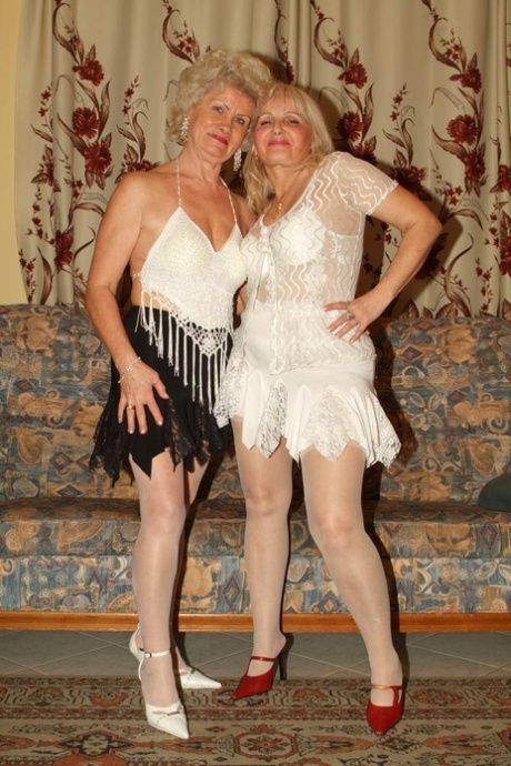 Blonde Grandmothers Engage In Lesbian Foreplay On A Chesterfield