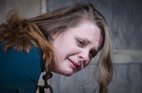 Restrained chick Nora Riley cries a river of tears during lezdom games