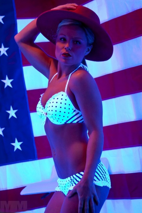 SFW action involves Meet Madden, the sexy girl, taking off her bikini top.