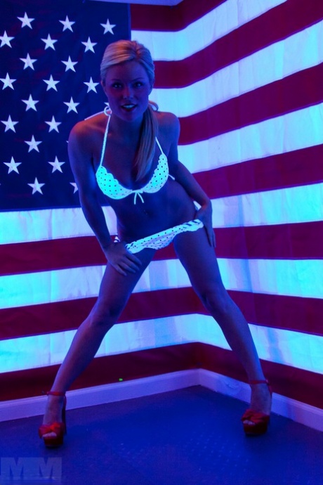 During SFW action, Meet Madden removes her bikini top.
