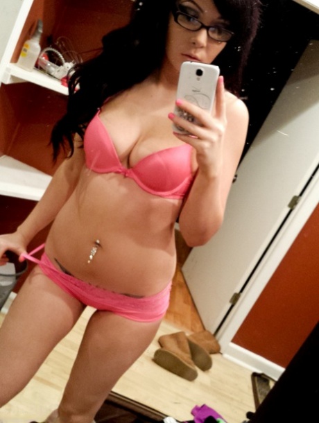 A solitary, long-haired individual with short black hair named Sabrina Sins takes stunning nude selfies.