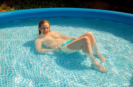 Natural Redhead Julia Fleming Frees Her Big Natural Tits In Above Ground Pool