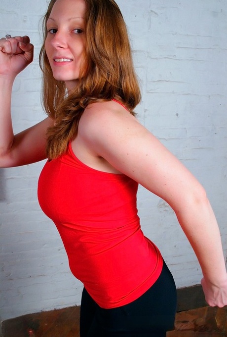 Extends stretching in spandex pants, redhead amateur Amber strips to a thong for coverage.