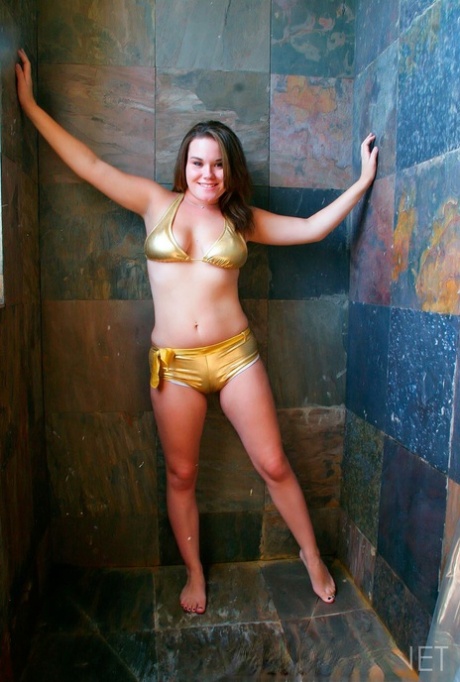In the shower, a fluent lad Samantha takes off in a gold bikini.