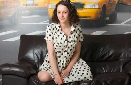 Undroed: Brunette amateur Hanna Bollie exposes her large 'non-native tits' while undressing.
