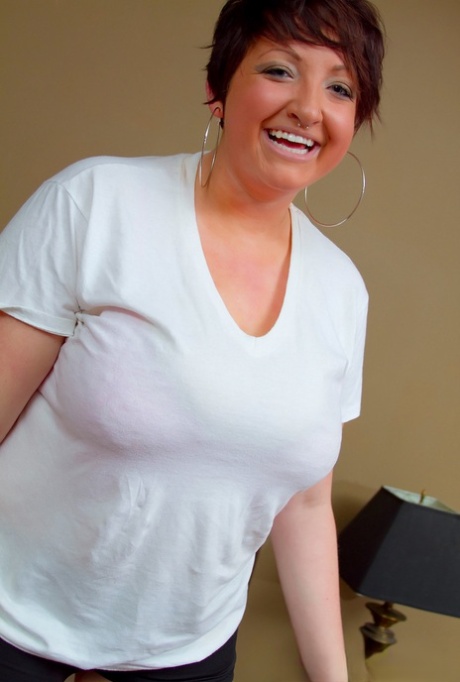 Lainey, a six-year-old plump man, dresses in a white T-shirt that has big breasts.