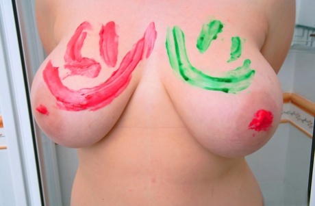 Chubby amateur dabbles with boobs by applying finger paint before bathing.