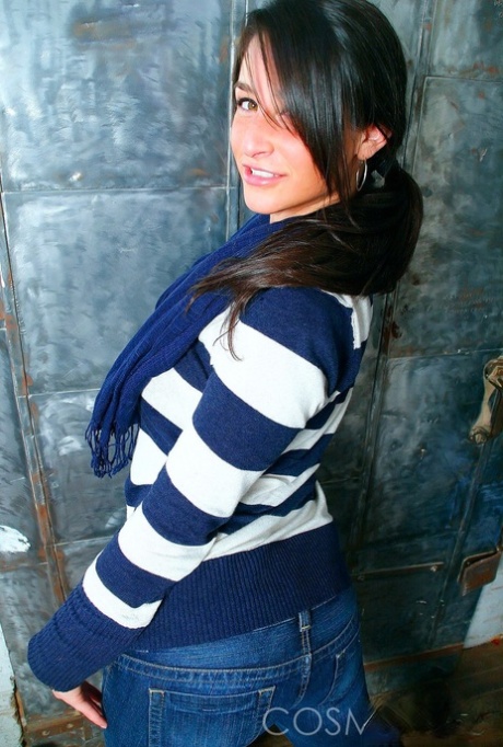 The amateur model, Christine dresses in a black bra and panty.