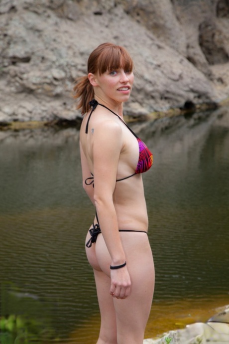 Hot Redhead Amateur Disrobes At The Lake To Go Skinny Dipping & Sunbathe Nude