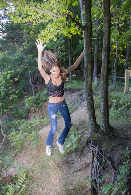 Amateur wrestler Becca Clark discovers her comfortable tits in the back yard.