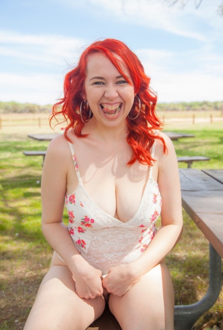 Plump Redhead Alisyn Carliene Bares Her Natural Tits And Twat On Picnic Table