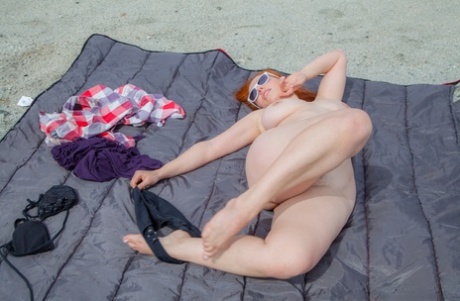 Mature Redhead Removing Her Bikini Top At The Beach To Release Her Saggy Tits