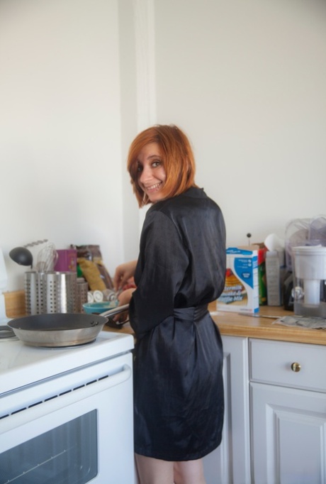 Amateur Redhead Chesea Bell Sheds Her Black Satin Robe To Cook In The Nude