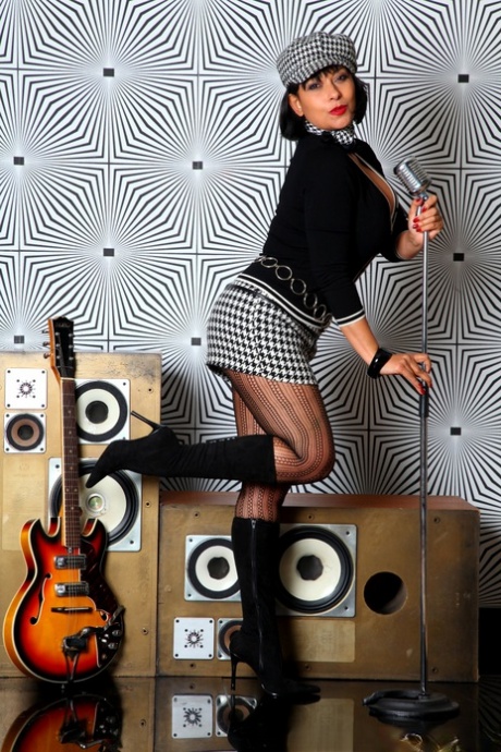 Retro Danica In 60s Style Mini Skirt, Pantyhose And Boots